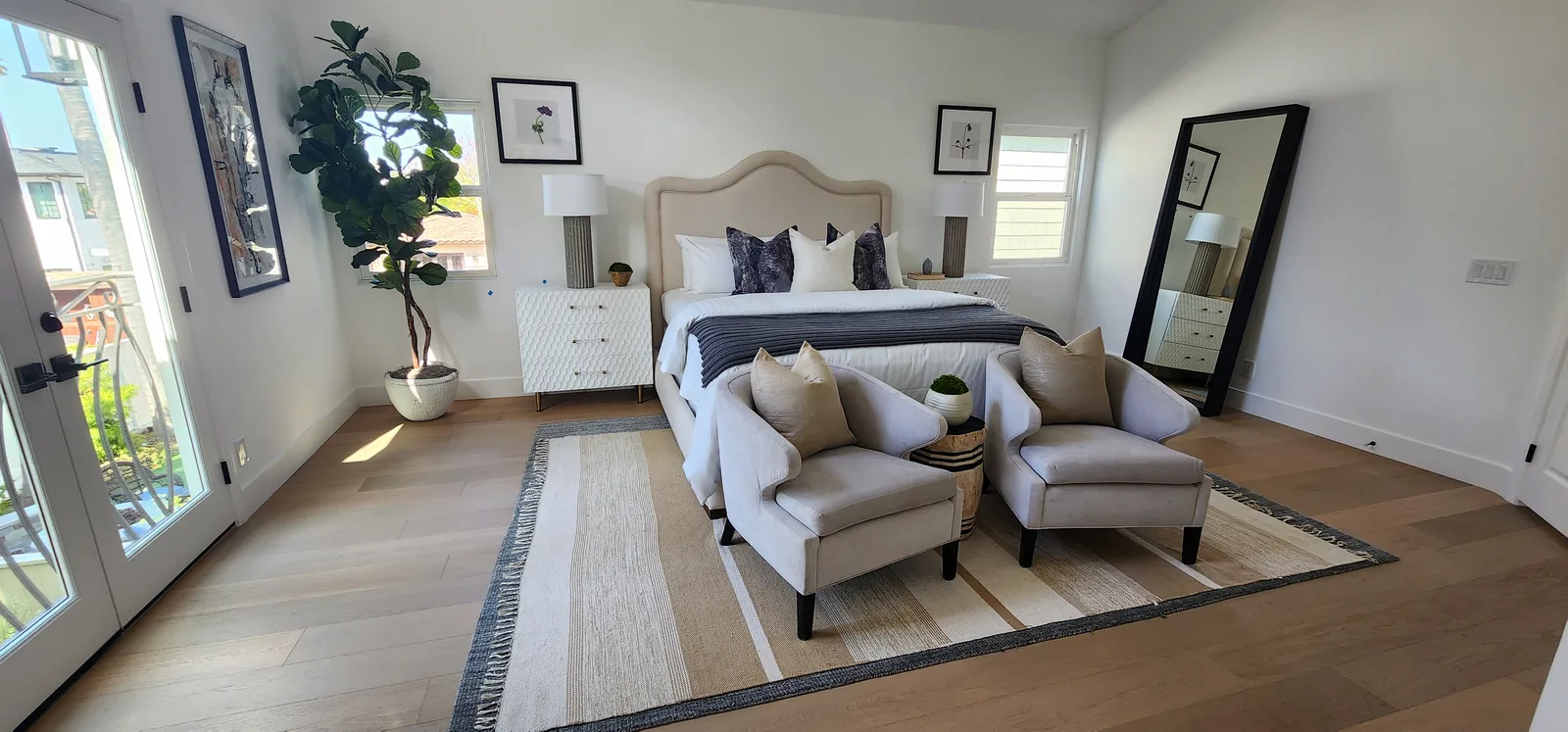 Furnished bedroom with light oak flooring