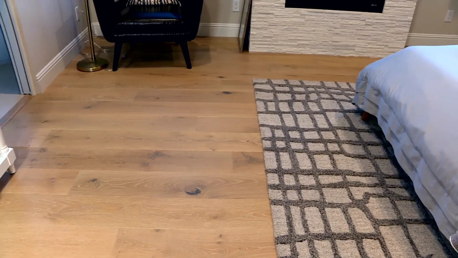 Bedroom with wide-plank floor