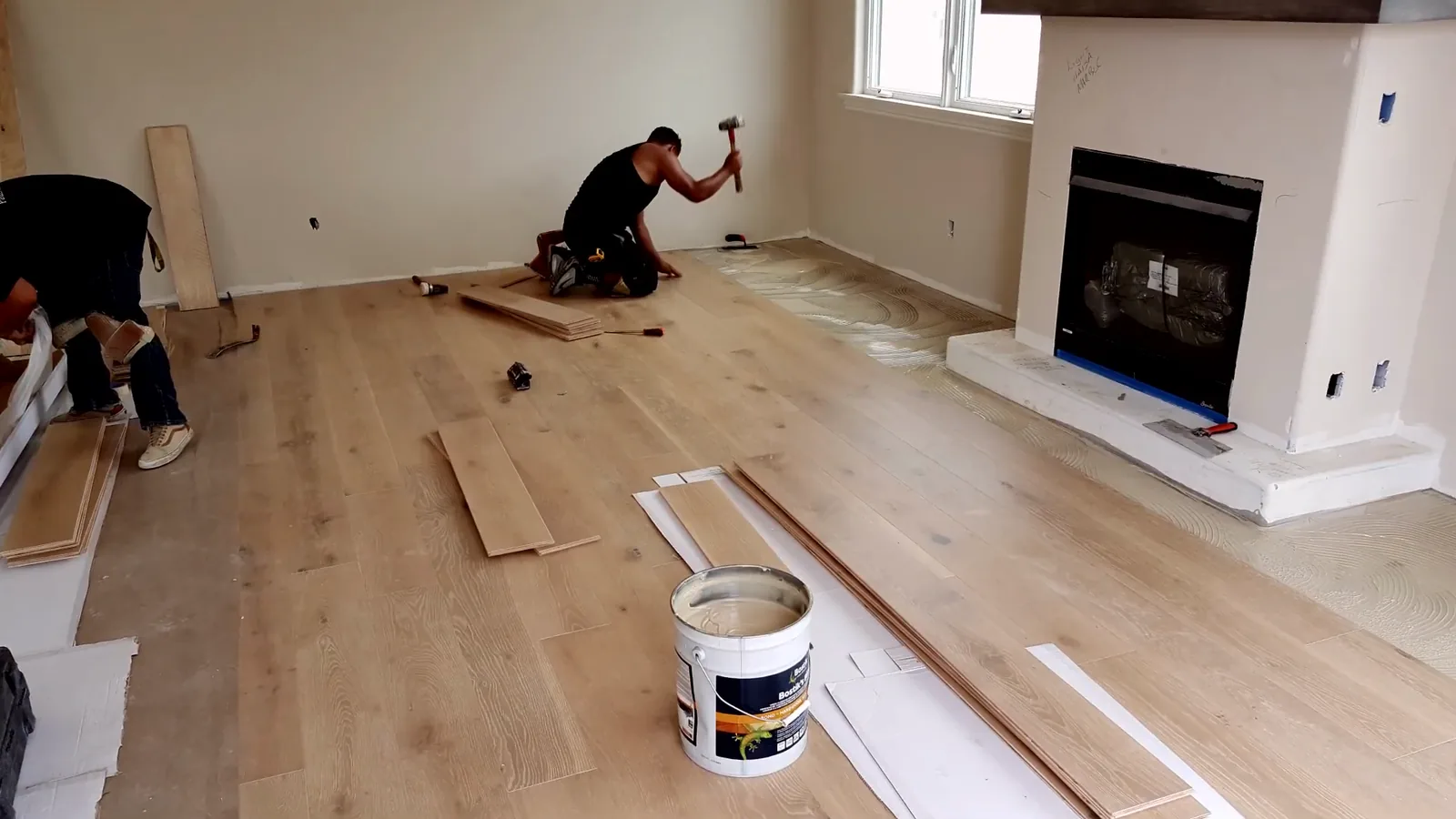 Great room mid-installation with planks laid out