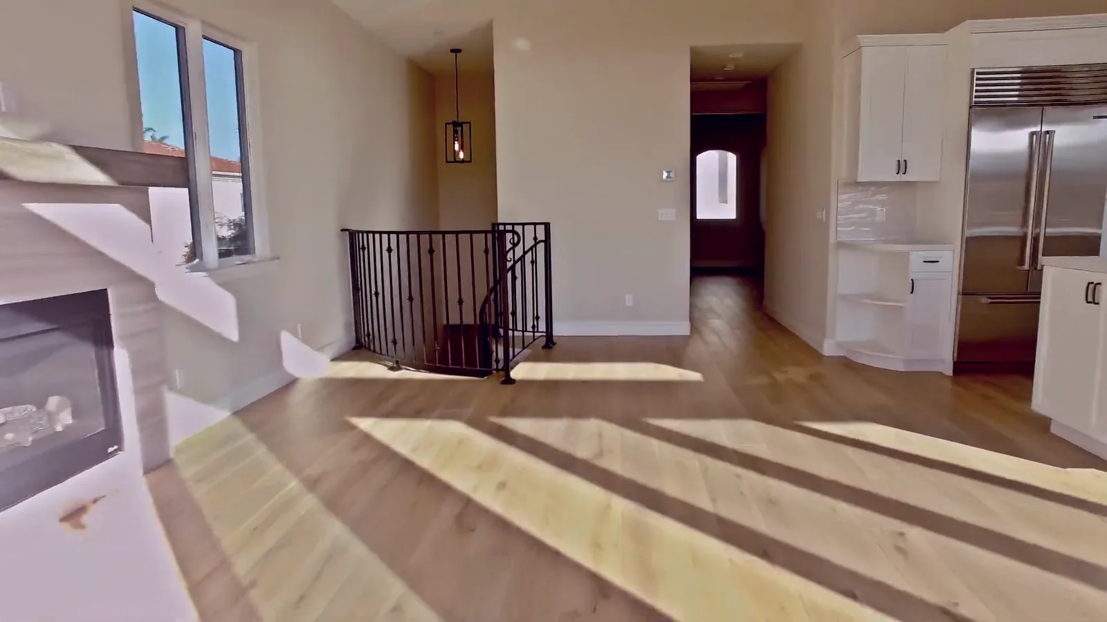Hallway with wide-plank flooring