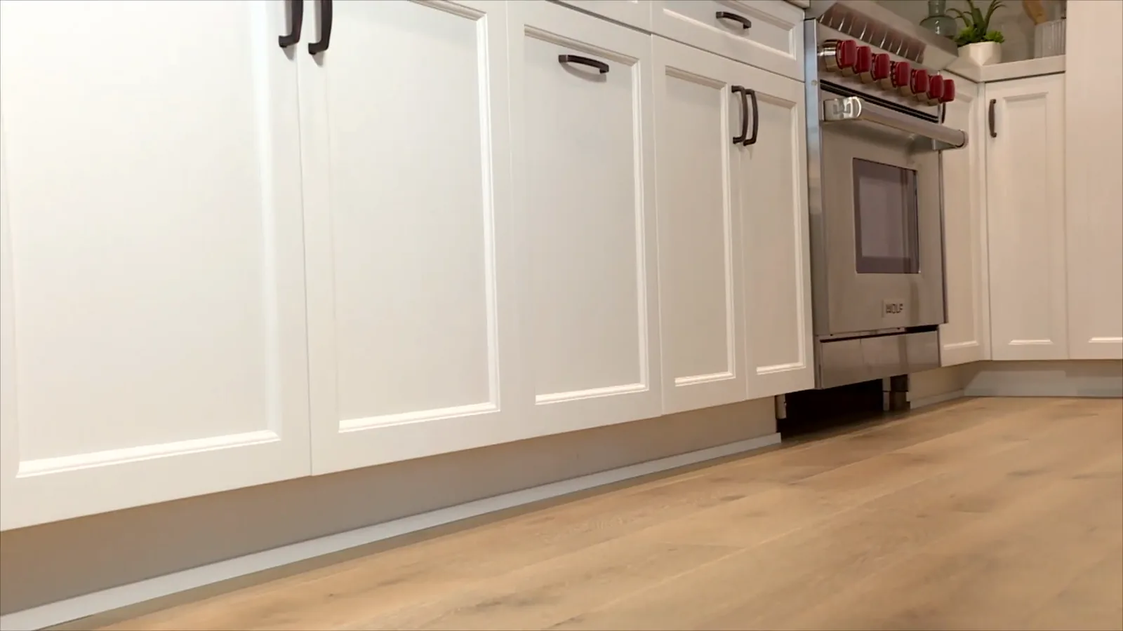 Engineered oak flooring in a white kitchen