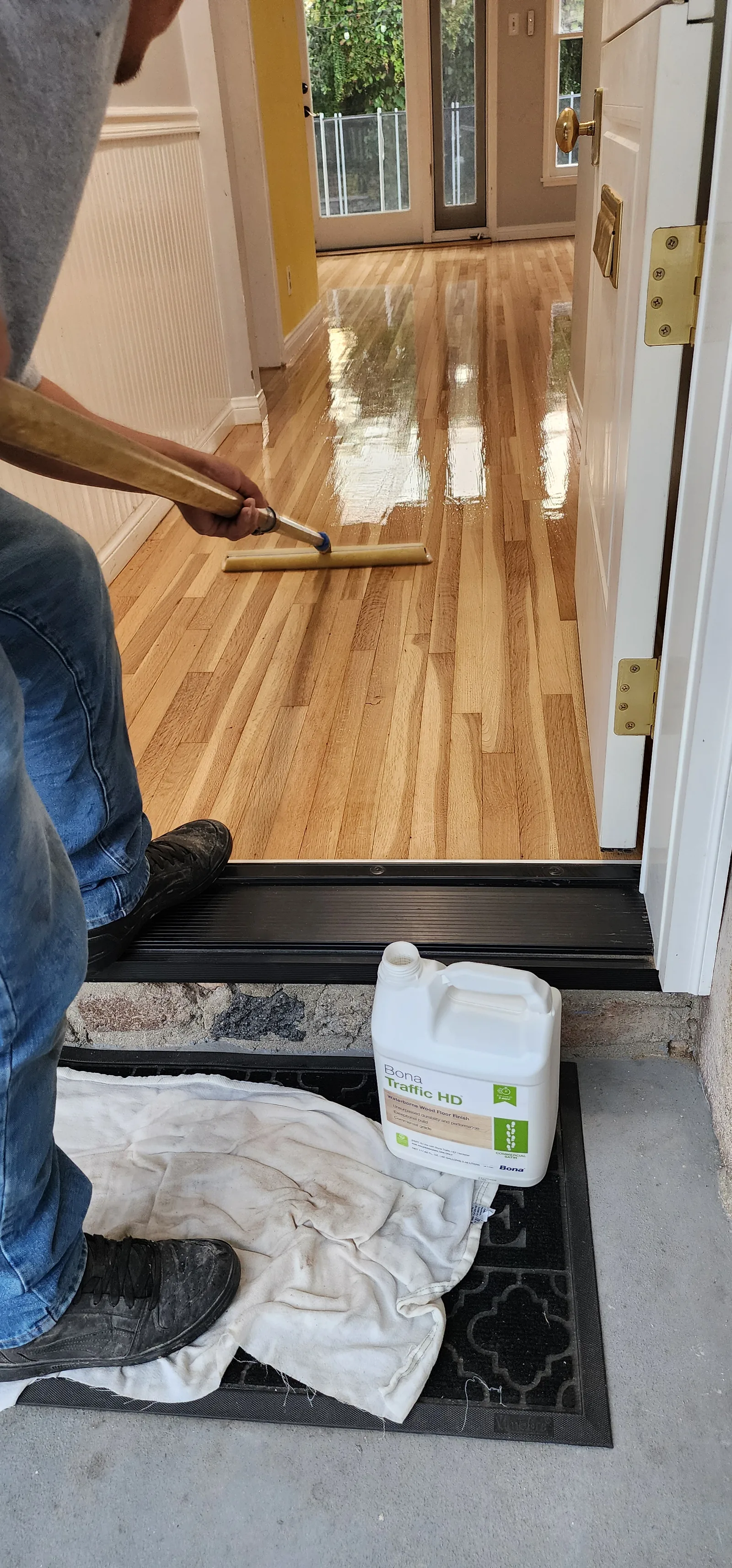 Finishing golden oak strip flooring at a doorway threshold